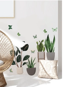 Watercolor green potted plant wall stickers with butterflies in a cozy living room scene
