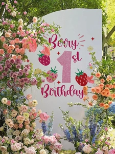 Close-up of Berry 1st Birthday party backdrop with pink glitter number one and strawberry