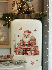 Detailed view of Santa and cats Christmas wall stickers on a white kitchen fridge