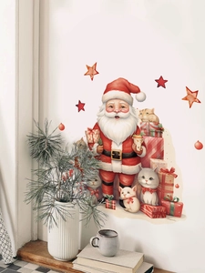 Detail view of Santa Claus and kittens wall stickers on a clean white living room wall