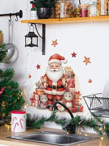 Detail of Christmas wall stickers featuring Santa Claus and cats on a kitchen wall surface