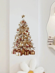 Detail of Christmas tree wall sticker with gold ornaments and gift boxes on white wall