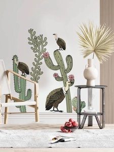 Detailed view of self-adhesive cactus and vulture wall stickers in a cozy home setting