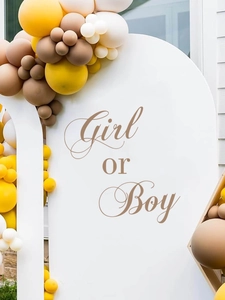 Detail of Girl or Boy party backdrop with yellow and cream balloon arch decoration