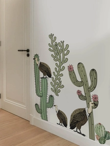 Detailed view of cactus and vulture wall decals on a clean white interior background