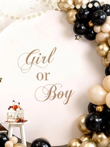 Detail of Girl or Boy sticker on round party backdrop with balloons and cake