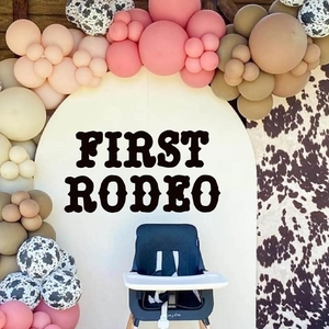 First Rodeo cowboy themed pink and brown balloon arch with cow print party decals