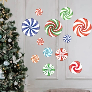 Colorful peppermint candy wall decals with a decorated Christmas tree in a cozy room