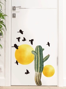 Detailed PVC wall sticker showing green cactus and black birds on a white interior door