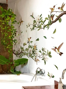 Macro detail of bird and magnolia flower wall decals showing vibrant colors and textures