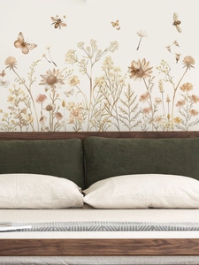 Detailed retro hand-painted wildflower wall decal displayed behind a bedroom headboard