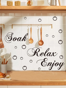 Detail of Relax Soak Enjoy PVC wall decals with black bubble patterns on white tiles
