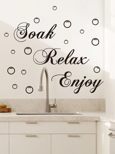 Detail of Relax Soak Enjoy bathroom wall decals with bubbles on a modern wall