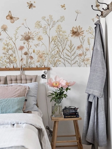 Detailed view of bohemian wildflower wall stickers with butterfly and bee motifs in a bedroom