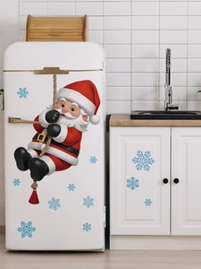 3D Santa Claus wall sticker with blue snowflakes on a white kitchen refrigerator