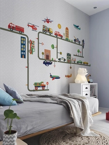 Detail of cartoon vehicle wall stickers showing fire truck and police car in a bedroom