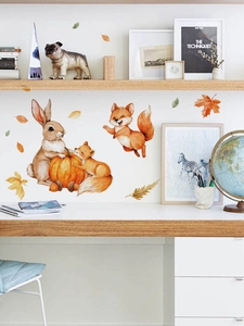 Detail of bunny and foxes autumn wall stickers on white wall above a wooden desk