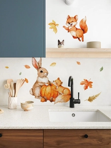 Detail of fox and rabbit wall stickers in watercolor style on a kitchen backsplash