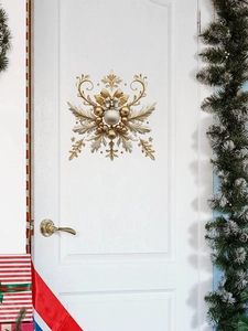 Detailed golden snowflake PVC wall sticker on white door with festive Christmas decor