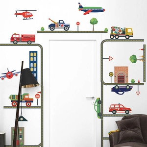 Cartoon city traffic wall decals with airplanes and cars around a white bedroom door