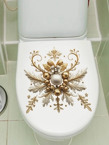 Detailed golden baroque style snowflake decals applied on a white toilet lid background