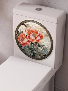 Detail of round PVC toilet sticker with orange floral stained glass pattern and Greek key border