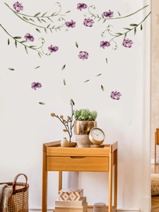 Detail showing purple floral vine wall stickers in a cozy Nordic style living room