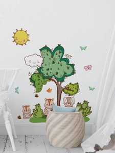 Detailed view of forest animals and tree wall stickers in a cozy child room setting