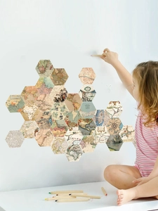 Detail of hexagonal world map wall stickers with vintage nautical patterns in a nursery