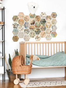 Detailed view of hexagonal vintage world map wall stickers in a cozy nursery room setting