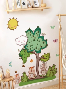 Detail of cartoon wall stickers featuring a smiling sun, big tree, and squirrels on white wall