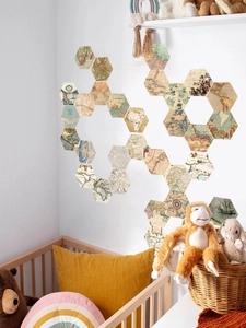 Macro detail of hexagonal wall stickers with vintage world map design for home decor