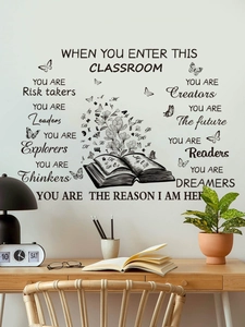 Détail du sticker mural anglais inspirant avec livre et papillons sur un mur de bureau