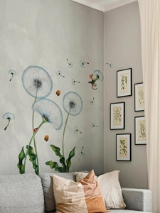 Detail of blue dandelion wall stickers with cute bees and mice in a cozy living room