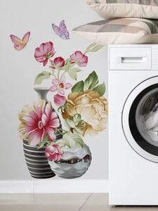 Detailed view of floral wall decals featuring butterfly motifs and modern vase patterns