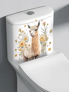 Close-up of a decorative alpaca and yellow wildflower sticker on a white toilet water tank