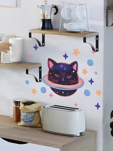 Cartoon black cat with planet ring and colorful stars wall stickers on a white kitchen wall