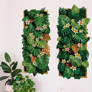 Set decorativo da parete con foglie di monstera e frangipani in cornici di legno