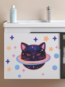 Detailed view of galaxy cat wall stickers with colorful stars on a white furniture surface