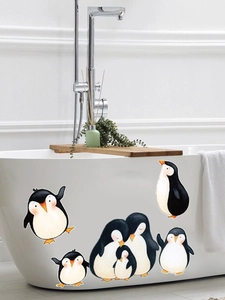Detail of waterproof cartoon penguin wall stickers in a modern minimalist bathroom setup