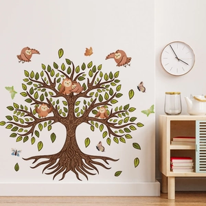 Nursery wall sticker featuring a large tree with green leaves and colorful owls