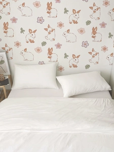 Detailed view of cute rabbit and floral wall stickers in a cozy nursery bedroom setting