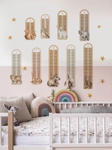 Educational forest animal wall decals with math addition charts in a nursery room