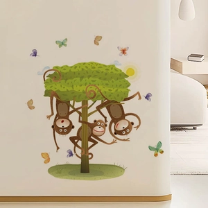 Cartoon monkeys and butterflies playing on a green tree wall sticker for nursery decor