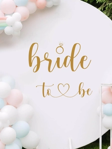 Detail of Bride to Be wall sticker with gold lettering and colorful party balloon arch