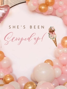 Detail view of 'She's been scooped up' bridal party backdrop with pink and gold balloons