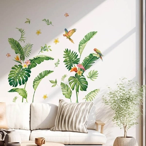 Tropical wall stickers with banana leaves and parrots on a modern living room sofa background