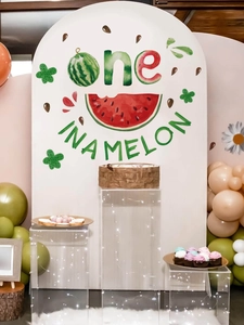 Close-up of One in a Melon watermelon theme arch banner for a 1st birthday party setup