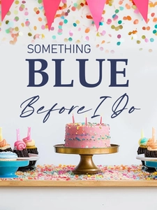 Detail of pink tiered wedding cake on gold stand with 'Something Blue' party banner