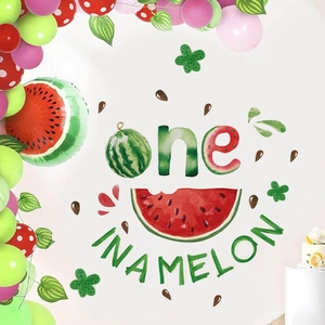 One in a Melon 1st birthday party backdrop with watermelon balloons for decoration